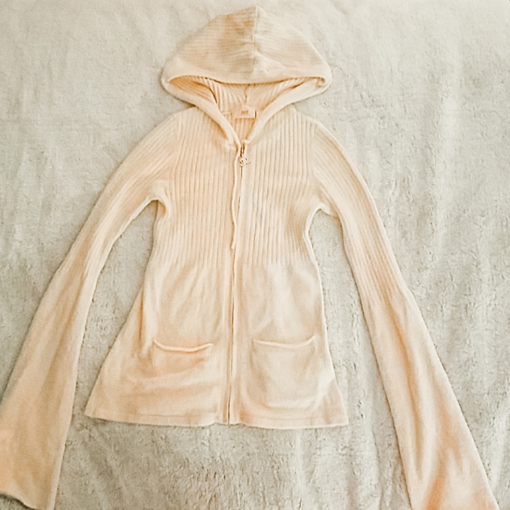 light pink J Lo sweater